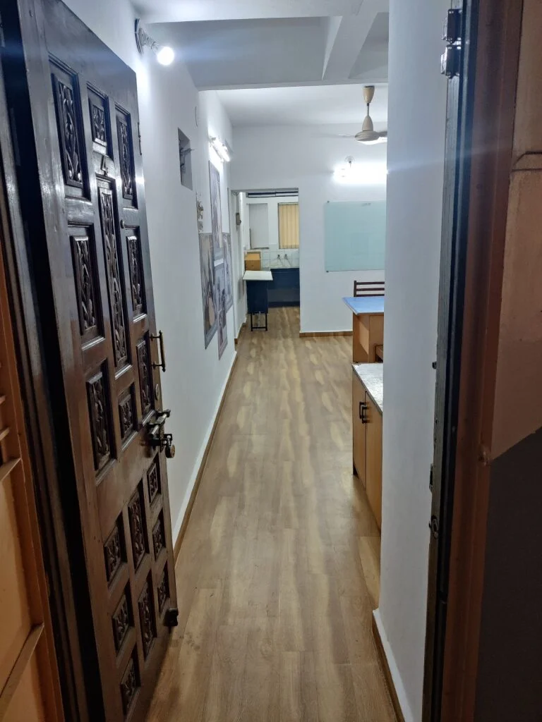 Entrance hallway of LK Vet Care with wooden flooring and modern decor.